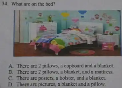 What are on the bed? A. There are 2 pillows, a cupboard and a blanket. B. There are 2 pillows, a blanket, and a