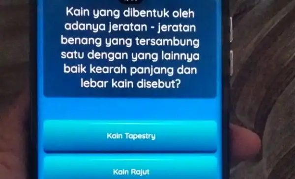 Kain yang dibentuk oleh adanya jeratan -jeratan benang yang tersambung satu dengan yang lainnya baik kearah panjang dan lebar kain disebut? Kain Tapestry Kain